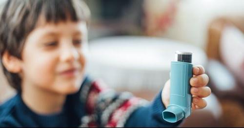 young boy with inhaler